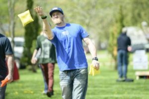 Man playing Cornhole