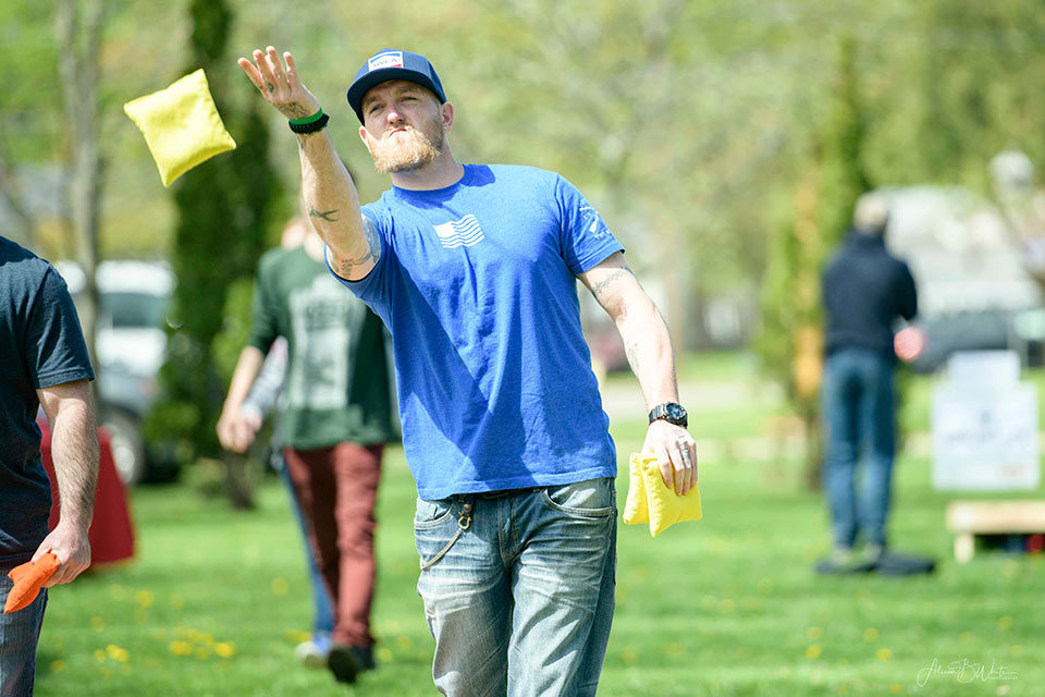 Man playing cornhole